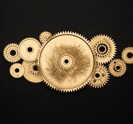 photo of golden cogwheel on black background